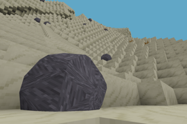 Cinematic view of boulders on a large sandy hill