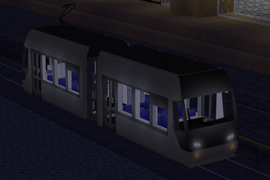 TLR0600 Tram at night in a city setting next to a platform