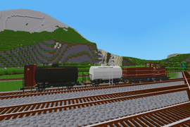 A pair of small tank wagons await departure from the yard.