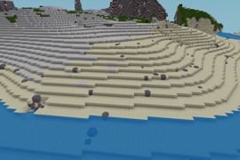 Boulders spawned on sand near the water