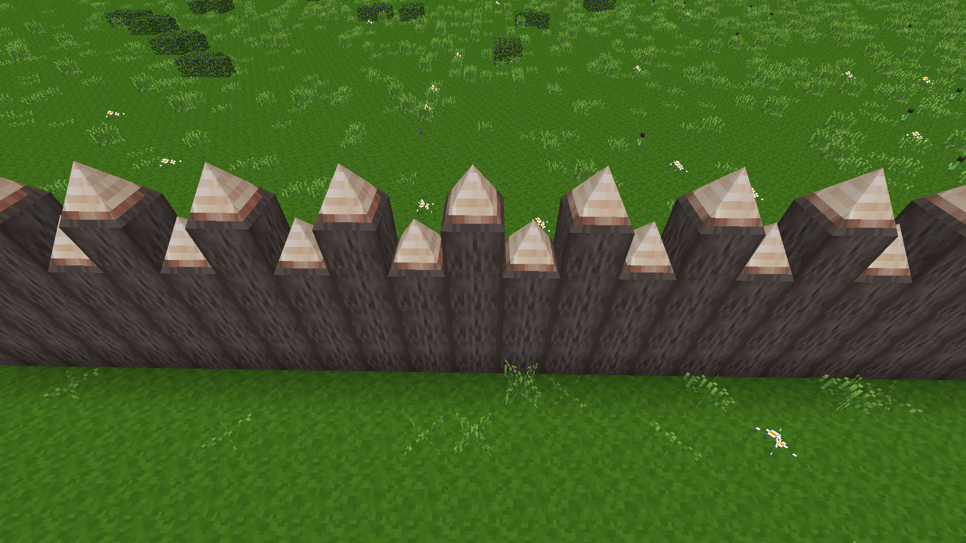 A spiked palisade made of pine logs