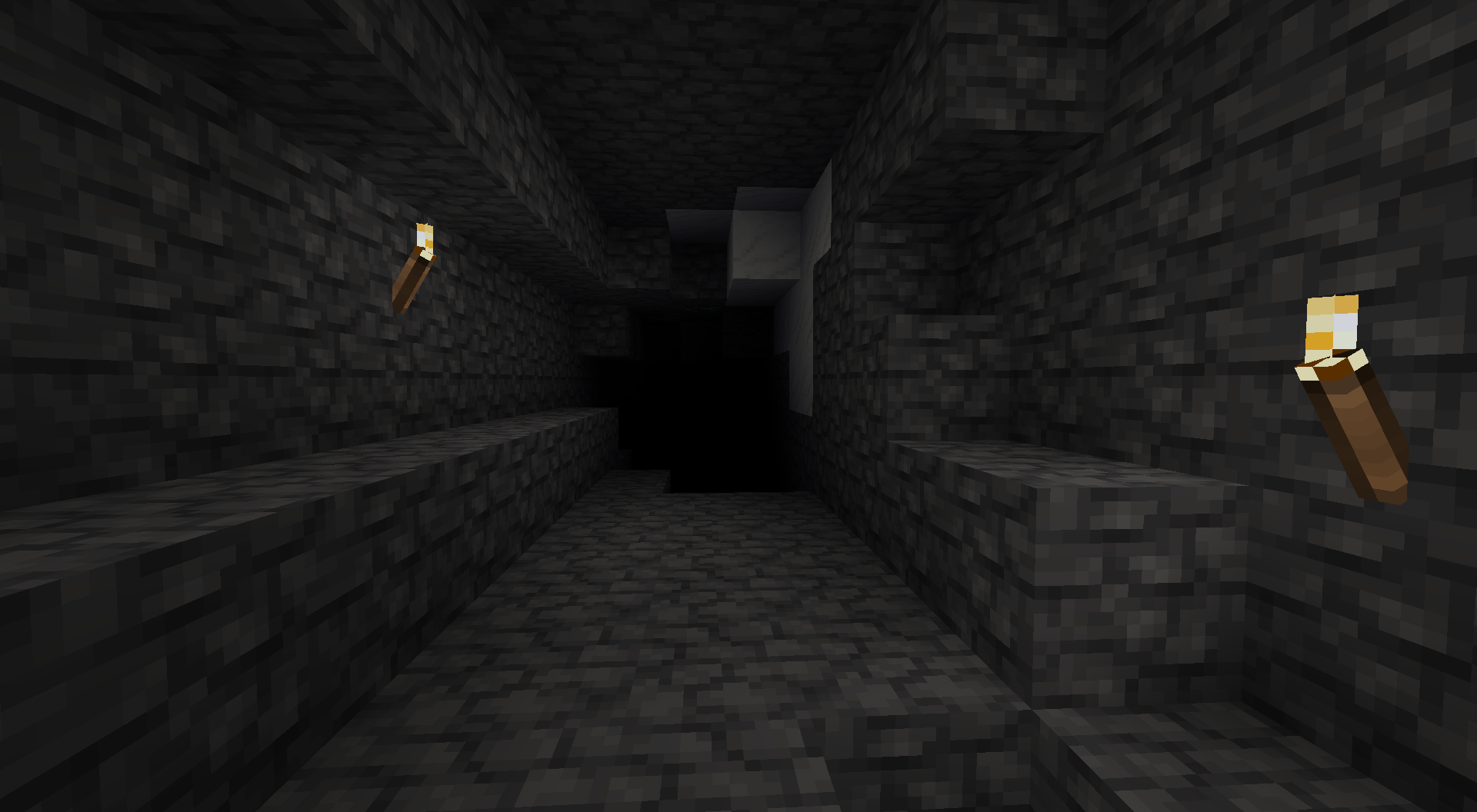 A dark cave with deepslate walls